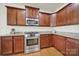 Modern kitchen with stainless steel appliances, granite countertops, and updated cabinetry at 54053 Flycatchers Ct, Fort Mill, SC 29707