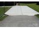 Long concrete driveway leading to the home's entrance, surrounded by green grass at 556 Roundtree Cir, Chester, SC 29706
