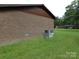 Brick exterior with green lawn and view of neighboring homes at 556 Roundtree Cir, Chester, SC 29706