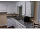 Well-lit kitchen area featuring ample counter space and double stainless steel sinks at 556 Roundtree Cir, Chester, SC 29706