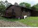 The home has a wooden deck and side entrance along with lush landscaping at 556 Roundtree Cir, Chester, SC 29706