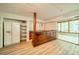 Basement features a wet bar, mini fridge, recessed lights, and access to screened porch at 5719 Doncaster Dr, Charlotte, NC 28211