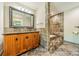 Bathroom featuring granite counter, stone backsplash and step-up tub at 5719 Doncaster Dr, Charlotte, NC 28211