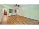 Bedroom with hardwood floors, closet and door to bathroom at 5719 Doncaster Dr, Charlotte, NC 28211