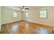 Bright bedroom with hardwood floors, three windows and a ceiling fan at 5719 Doncaster Dr, Charlotte, NC 28211
