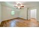 Light and airy bedroom with hardwood floors and closet at 5719 Doncaster Dr, Charlotte, NC 28211