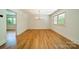 Open dining room with hardwood floors and modern lighting fixtures at 5719 Doncaster Dr, Charlotte, NC 28211