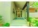 Inviting front porch with stone tile detail, painted brick and a stylish front door at 5719 Doncaster Dr, Charlotte, NC 28211