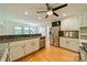 Contemporary kitchen features stainless steel appliances and granite counters with hardwood floors at 5719 Doncaster Dr, Charlotte, NC 28211