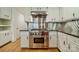 Bright kitchen showcasing a stainless steel range with hood and granite countertops at 5719 Doncaster Dr, Charlotte, NC 28211