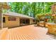 A spacious deck with an outdoor kitchen, grill, and sink, perfect for outdoor entertaining at 5719 Doncaster Dr, Charlotte, NC 28211