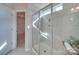 Bathroom featuring glass enclosed shower with tiled walls, niche, and view into a walk-in closet at 574 Altamonte Dr, Clover, SC 29710
