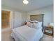 Comfortable bedroom with white bedding, neutral decor, and a view into the hallway at 574 Altamonte Dr, Clover, SC 29710