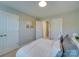 Cozy bedroom showcasing neutral tones, plush bedding, and ample closet space at 574 Altamonte Dr, Clover, SC 29710