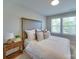 Comfortable bedroom featuring a padded headboard, plush bedding, and a wooden nightstand at 574 Altamonte Dr, Clover, SC 29710