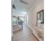 Inviting hallway with wood floors, staircase, neutral paint, and an elegant console table at 574 Altamonte Dr, Clover, SC 29710