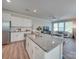 Bright kitchen featuring granite countertops, stainless steel appliances, and seamless flow to the living area at 574 Altamonte Dr, Clover, SC 29710