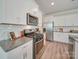 Bright kitchen featuring stainless steel appliances, ample counter space, and white subway tile backsplash at 574 Altamonte Dr, Clover, SC 29710