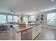 Modern kitchen island with bar seating, granite countertops, stainless steel appliances, and stylish décor at 574 Altamonte Dr, Clover, SC 29710