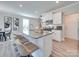 Modern kitchen island with bar seating, granite countertops, stainless steel appliances, and stylish décor at 574 Altamonte Dr, Clover, SC 29710