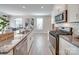 Modern kitchen boasts stainless steel appliances, granite countertops, and an open view to the dining area at 574 Altamonte Dr, Clover, SC 29710