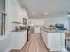 Modern kitchen featuring white cabinets, stainless steel appliances, and an island with seating at 574 Altamonte Dr, Clover, SC 29710