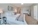 Inviting main bedroom with soft carpeting, a decorative mirror, and ample natural light at 574 Altamonte Dr, Clover, SC 29710