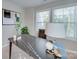 Bright home office featuring a modern desk, natural light from two windows, and stylish decor accents at 574 Altamonte Dr, Clover, SC 29710