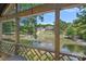 Beautiful view of the community pond from the deck, with lush landscaping and upscale homes at 5915 Mammoth Rd, Charlotte, NC 28270