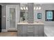 Elegant bathroom with granite countertops, double sinks, and a separate tub at 5915 Mammoth Rd, Charlotte, NC 28270