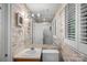 Bright bathroom featuring vanity and sink with an adjacent shower and ample vanity lighting at 5915 Mammoth Rd, Charlotte, NC 28270