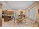 Traditional dining room with chandelier lighting, neutral walls, and glass table near an outdoor patio at 5915 Mammoth Rd, Charlotte, NC 28270