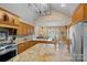Gourmet kitchen that opens into the dining room with granite countertops, stainless steel appliances, and custom cabinetry at 5915 Mammoth Rd, Charlotte, NC 28270
