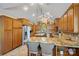 Spacious gourmet kitchen with a large island, granite countertops, custom cabinets, and stainless steel appliances at 5915 Mammoth Rd, Charlotte, NC 28270