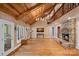 Open living room with hardwood floors, vaulted ceilings, stone fireplace and lots of natural light at 5915 Mammoth Rd, Charlotte, NC 28270