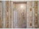 Tiled shower stall featuring glass doors and multiple shower heads in this updated bathroom at 5915 Mammoth Rd, Charlotte, NC 28270