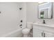 Clean bathroom with a tub and shower combination, bright lighting, vanity, and tiled floor at 6007 Charing Pl, Charlotte, NC 28211