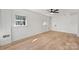 Bright, spacious bedroom with hardwood floors, a ceiling fan, and abundant natural light at 6706 Queensberry Dr, Charlotte, NC 28226
