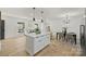 Open-concept kitchen with large island, stainless appliances, and an eat-in dining area at 6706 Queensberry Dr, Charlotte, NC 28226