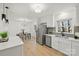 Well-lit kitchen with stainless appliances, quartz countertops, and modern cabinetry at 6706 Queensberry Dr, Charlotte, NC 28226