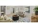 Comfortable living room featuring a stylish rug, modern furniture, and ample natural light at 6706 Queensberry Dr, Charlotte, NC 28226