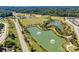 Beautiful aerial view of the community, featuring ponds with fountains and well-maintained sports fields and recreational areas at 6878 Spring Peeper Ln, Lancaster, SC 29720