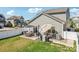 Large backyard featuring a patio with dining furniture, grill, and a well-maintained lawn at 6878 Spring Peeper Ln, Lancaster, SC 29720