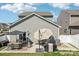 Large backyard featuring a patio with dining furniture, grill, and a well-maintained lawn at 6878 Spring Peeper Ln, Lancaster, SC 29720