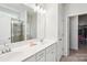 Bathroom featuring double sinks with a large mirror, and a glass enclosed shower at 6878 Spring Peeper Ln, Lancaster, SC 29720