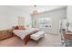 Bright bedroom with neutral colors, a window with blinds, and stylish decor at 6878 Spring Peeper Ln, Lancaster, SC 29720