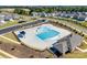 Aerial shot of the community pool area featuring a lap pool, splash pad, covered seating, and nearby parking at 6878 Spring Peeper Ln, Lancaster, SC 29720