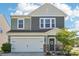 Charming two-story home with a manicured front yard, two car garage and beautiful stone accents at 6878 Spring Peeper Ln, Lancaster, SC 29720