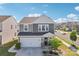Charming two-story home with a manicured front yard, two car garage and beautiful stone accents at 6878 Spring Peeper Ln, Lancaster, SC 29720
