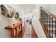 Inviting foyer featuring dark hardwood floors, a decorative console table, and an open view to the living areas at 6878 Spring Peeper Ln, Lancaster, SC 29720